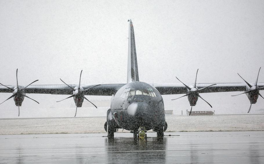Snow falls in March 2020 on a C-130J Super Hercules at Yokota Air Base, Japan. 