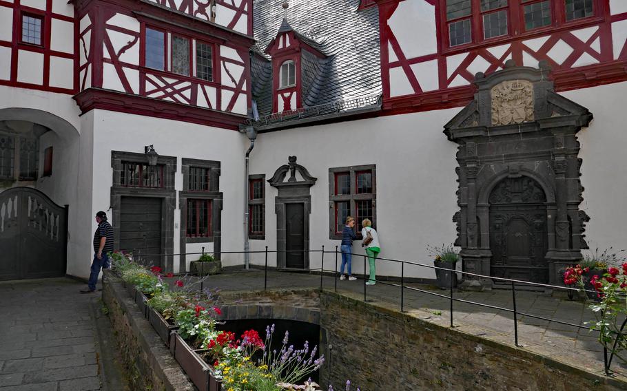 The inner courtyard at Buerresheim Castle, with the half-timbered buildings of the 17th-century Baroque residence.