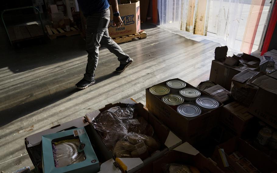 Warehouse staff perform morning operations at Connecticut Foodshare in Wallingford, Conn. Recent inflation and the loss of pandemic funding is increasing the overall costs at food banks across the country. 