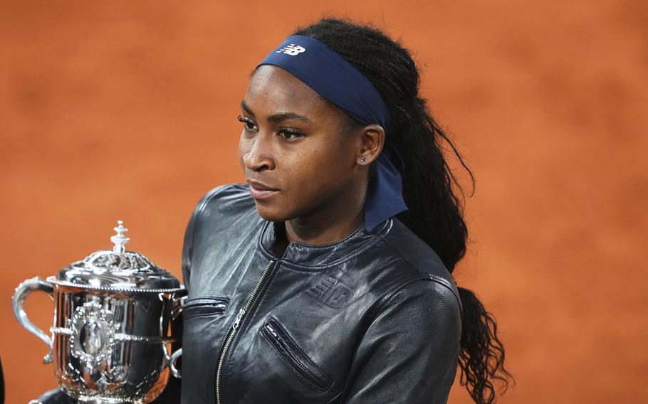Coco Gauff holds the French Open winner’s trophy.