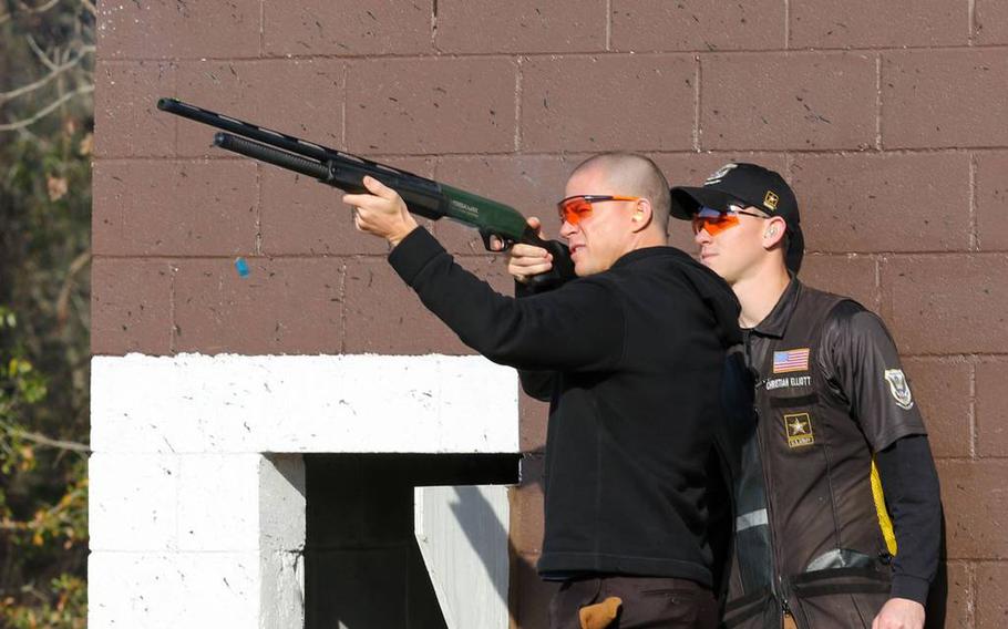 Channing Tatum fires a shotgun after a demonstration by the U.S. Army Marksmanship Unit at Fort Benning, Ga. on Feb. 11, 2022. Tatum visited to promote his new movie ‘Dog.’ 