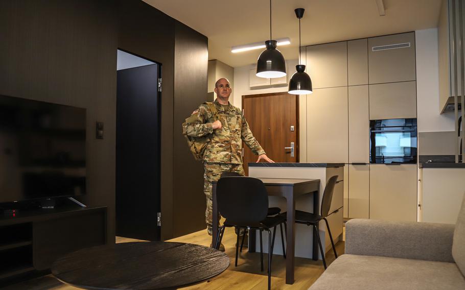 Sgt. 1st Class Kyle Stewart, an Army reservist stationed in Poland, stands inside his Poznan apartment Feb. 7, 2023. Stewart is assigned to V Corps, which is dual-headquartered in Fort Knox, Ky., and Poznan.