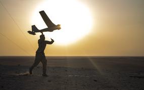 A U.S. Marine with India Company, 3rd Battalion, 5th Marine Regiment, 1st Marine Division, launches a RQ-20B Puma Small Unmanned Aircraft System during exercise Intrepid Maven 22.4 in the United Arab Emirates, Sept. 22, 2022. Intrepid Maven 22.4 is a U.S. Marine Corps Forces Central Command engagement series designed for bilateral and multilateral training engagements with partner nations and Marine Corps forces. (U.S. Marine Corps photo by Sgt. Jacob Yost)