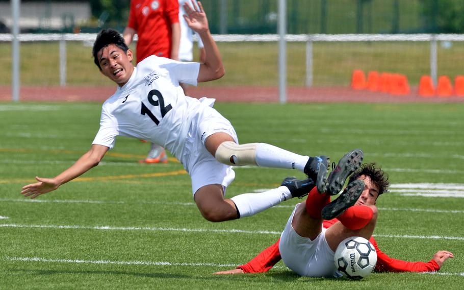 American Overseas School of Rome’s Lorenzo Di Gregorio upends Tommy Egan of Naples in the boys Division II final at the DODEA-Europe soccer championships in Kaiserslautern, Germany, Thursday, May 19, 2022. Naples defeated their Italy rivals 1-0.