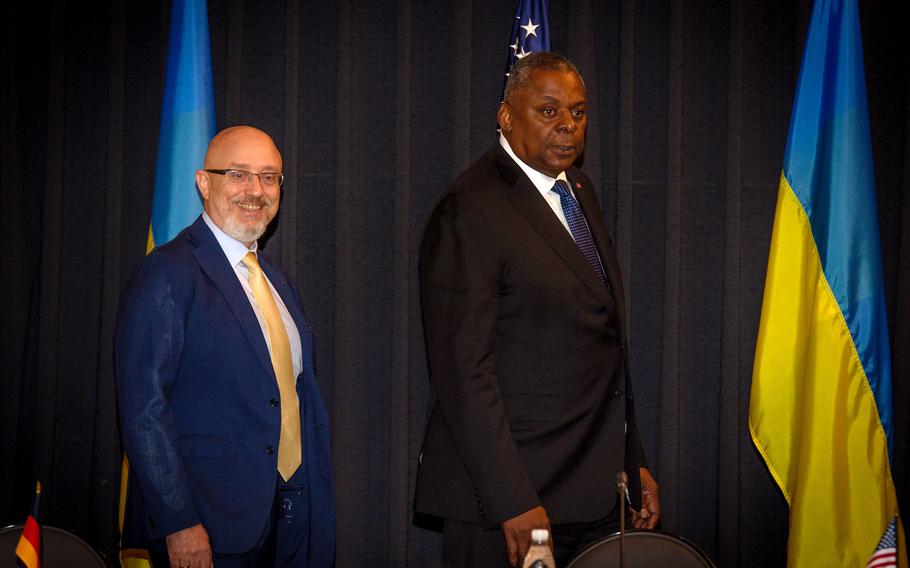 U.S. Defense Secretary Lloyd Austin, right, and Ukrainian Defense Minister Oleksiy Reznikov arrive at the Ukrainian Defense Contact Group meeting at Ramstein Air Base, Germany, Sept. 8, 2022.