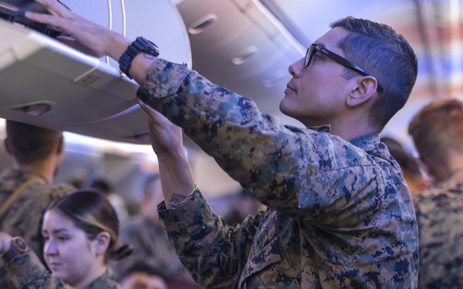 U.S. Navy Petty Officer 1st Class Daniel Formano, a hospital corpsman with Marine Rotational Force-Darwin, prepares to disembark at Royal Australian Air Force Base in Darwin, Australia, on March 24, 2024. 