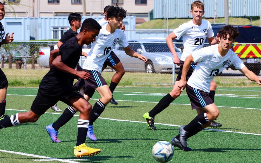 Daegu’s Dylan Watson dribbles the ball against Osan‘s Colin Hafdahl during Saturday’s DODEA-Korea soccer match. The Cougars won 5-1.