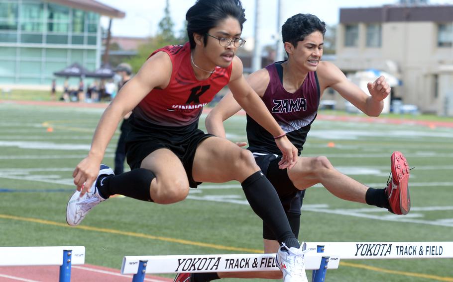 Nile C. Kinnick’s Angelo Dulce and Zama‘s Gabriel Escalera race side-by-side in what turned out to be a photo finish of the 300 hurdles during Saturday’s DODEA-Japan district track finals.