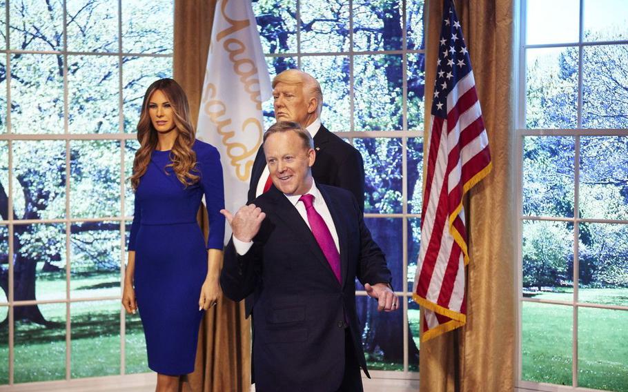 Former White House Press Secretary Sean Spicer unveils a new wax figure of  First Lady Melania Trump, on display next to a wax figure of President Trump at Madame Tussauds New York on April 25, 2018.