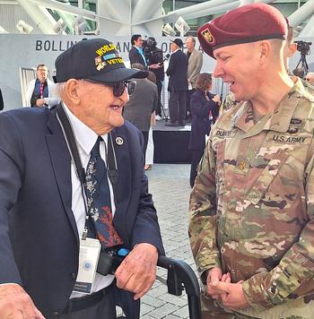 WWII veteran Edward Tresch Sr. talks with U.S. Army Maj. Joel DuBois after dedication of the Liberation Pavilion at the National World War II Museum in New Orleans, Nov. 3, 2023.
