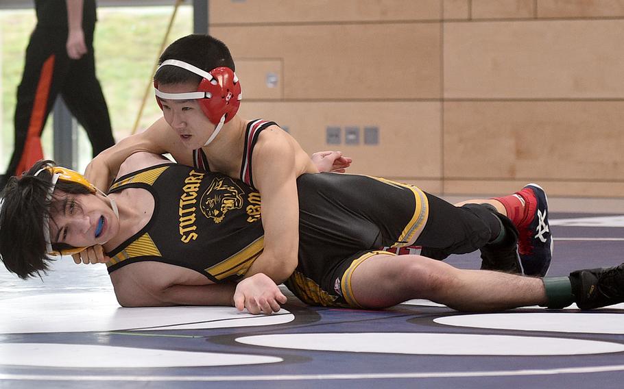 Kaiserslautern's Daniel Lee wrestles Stuttgart's Payton Kolesnikov during the 120-pound championship match during the DODEA Central scetional wrestling tournament at Ramstein High School on Ramstein Air Base, Germany. Lee pinned Kolesnikov at the 2:54 mark.