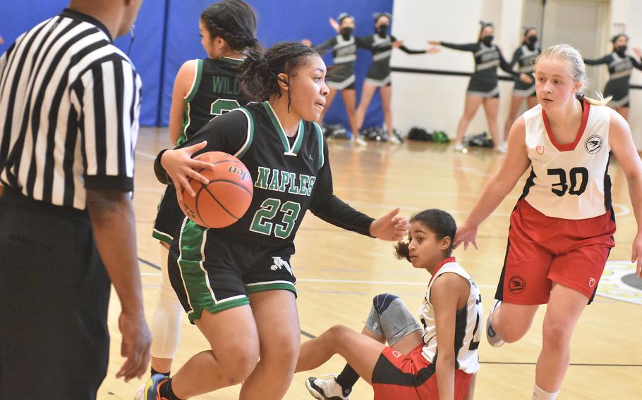 Naples' Shardaisa Greely successfully uses a screen in a game against the American Overseas School of Rome on Thursday, March 3, 2022, at the DODEA-Europe Division II basketball championships.