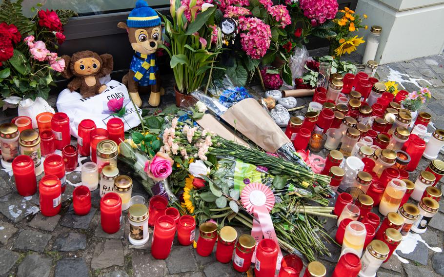 A memorial in Wittlich, Germany, a few days after a 28-year-old man was found dead with stab wounds, Aug. 19, 2023. A Spangdahlem airman will face a court-martial on murder and other charges related to the death.