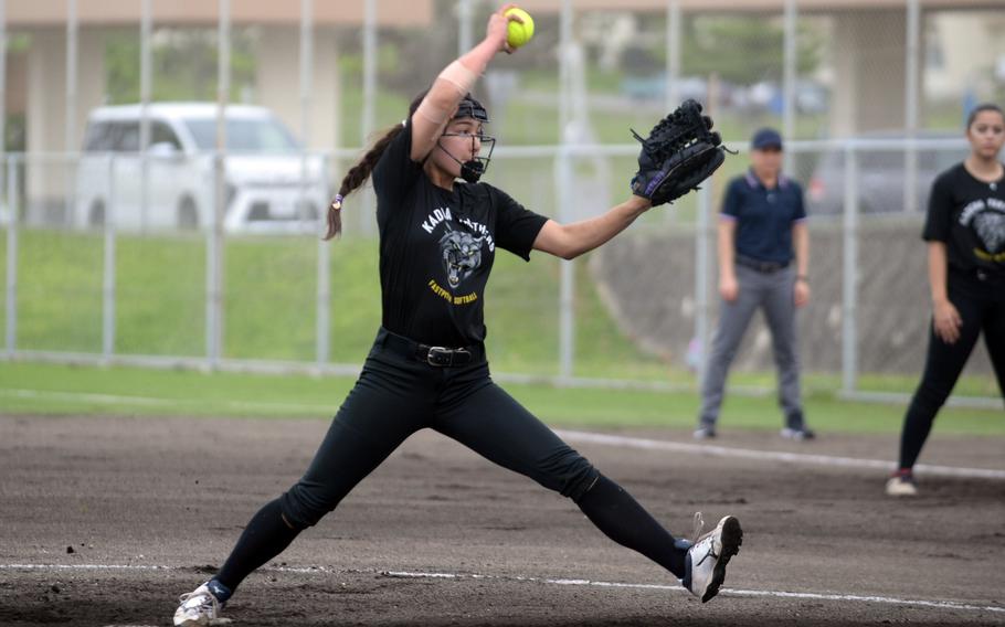 Kadena right-hander Julia Petruff kicks and delivers against Kubasaki during Monday's Okinawa softball regular-season finale. Petruff worked three innings, striking out three, and went 2-for-3 with a double and three RBIs in her first action this season after sitting with an injured elbow suffered in winter cheerleading. The Panthers won 14-1 to wrap up an unbeaten 8-0 regular season against the Dragons.