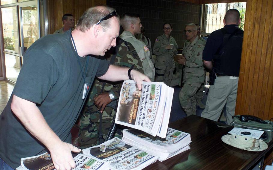 Robert Reismann organizes copies of Stars and Stripes coming fresh off the press in the Middle East in 2007. Reismann, who spent more than 30 years getting newspapers to troops, died Sept. 21, 2021 from complications related to cancer surgery.