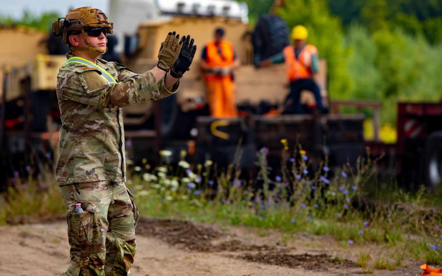 A U.S. soldier from the 3rd Armored Brigade Combat team, 1st Cavalry Division participates in railhead operations in Poland on July 26, 2022.