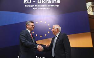 In this photo distributed by Dmytro Kuleba Twitter on Monday, Oct. 2, 2023, Ukrainian Foreign Minister Dmytro Kuleba, left, and EU High Representative for Foreign Affairs Josep Borrell shake hands at the opening of the informal EU Foreign Ministers meeting in Kyiv, Ukraine. Some of Europe's top diplomats have gathered in Kyiv in a display of support for Ukraine's fight against Russia's invasion as signs emerge of political strain in Europe and the United States about the war. (Dmytro Kuleba Twitter account via AP)