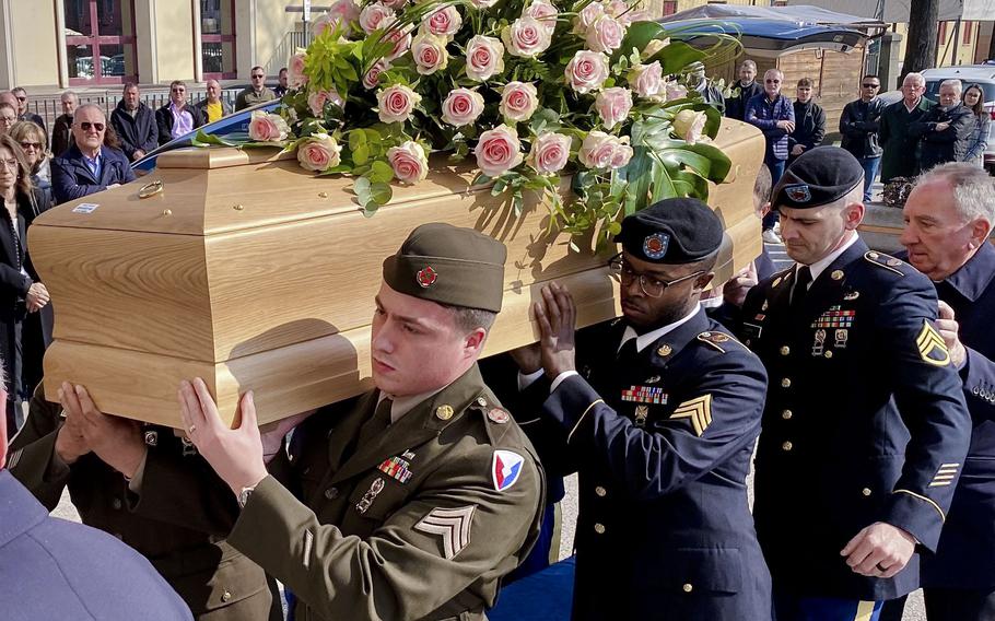 Soldiers from the U.S. Army Garrison Italy carry the coffin of Meri Mion at her funeral Thursday, March 9, 2023,  in Grumolo delle Abbadesse, near Vicenza, northern Italy. In April 2022, U.S. Army Garrison Italy returned to her the cake made for her thirteen birthday that was left on a window sill of her house and eaten in 1945 by American troops fighting near Vicenza. Meri Mion was 90. 