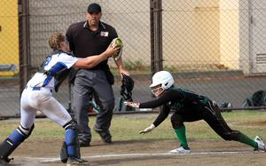 Yokota catcher Claire Smith gets set to tag Kubasaki runner Amaya Seranno during this weekend's inter-district play at Yokota.