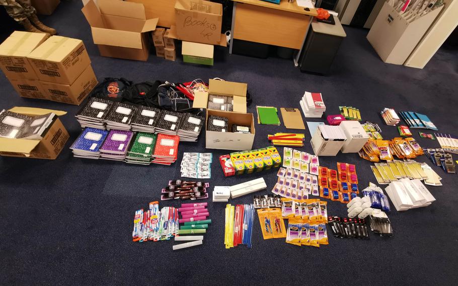 Tech. Sgt. Fariht Gomez lays out supplies at RAF Lakenheath in October 2020, bound for a village in southern Kenya. Gomez started sending supplies to a Maasai village after meeting the people there in 2018. The effort has grown while he has enlisted the help of airmen wherever he's been stationed.