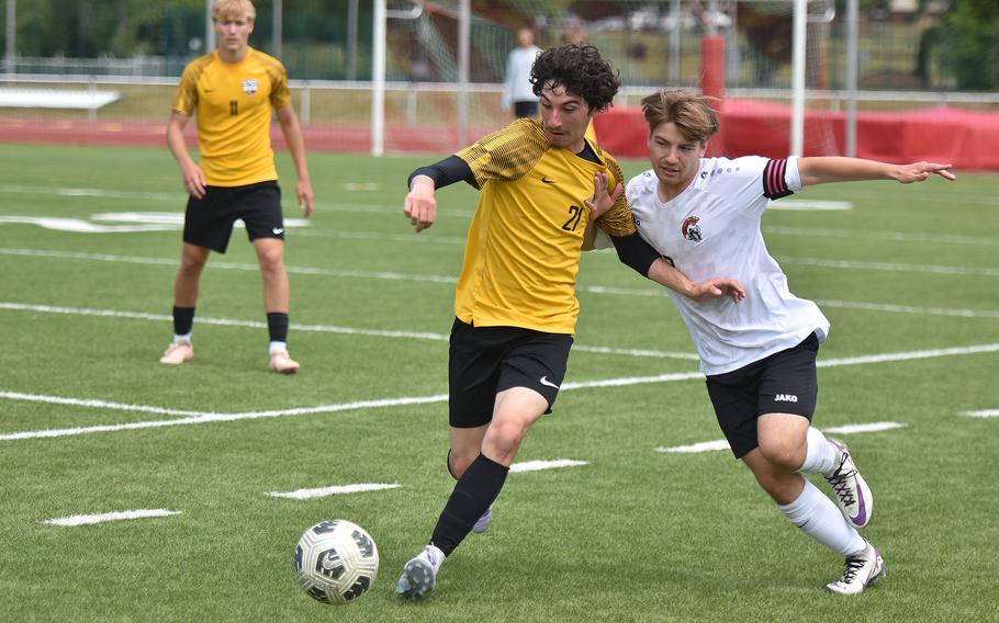 Stuttgart's James Sheppard and Kaiserslautern's Nico Engeman battle to get to the ball Tuesday, May 20, 2025, at the DODEA-Europe Division I boys soccer championships in Kaiserslautern, Germany.