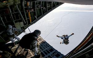 Naval Special Warfare members perform a high-altitude low opening jump, during the 2022 Arctic Edge Exercise. Arctic Edge is a U.S. Northern Command biennial defense exercise designed to demonstrate and exercise the ability to rapidly deploy and operate in the Arctic. (U.S. Navy Photo by Mass Communication Specialist 2nd Class Trey Hutcheson)