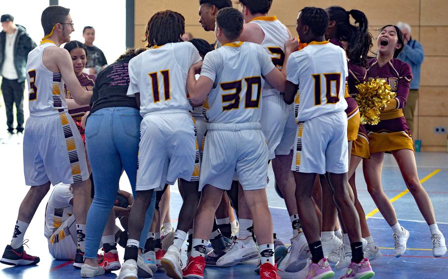 The Baumholder Buccaneers celebrate their 40-27 win over Spangdahlem in the Division III championship game at the DODEA-Europe basketball finals in Ramstein, Germany, Feb. 18, 2023. 