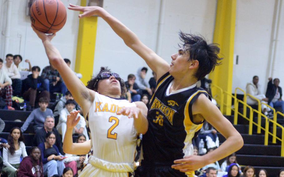 Kadena's Angel Torrado shoots against International School Bangkok's Mor Nahmias during Friday's ASIJ Kanto Classic quarterfinal. Kadena won 34-31 in extra time and faces Nile C. Kinnick in Saturday's semifinal.