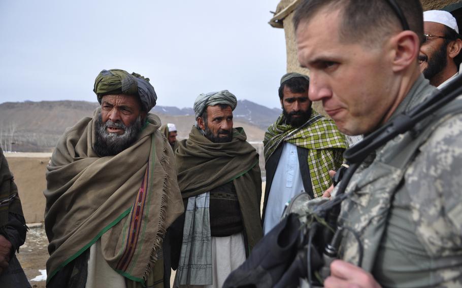 Capt. Kirby Jones looks frustrated during a talk with village elders in the town Khanjankhel, in Wardak province’s Nerkh District. The elders complained that they are not getting the same projects as their neighbors in the more peaceful eastern end of the district, while Jones countered that security is a prerequisite for development. They parted ways still at an impasse.