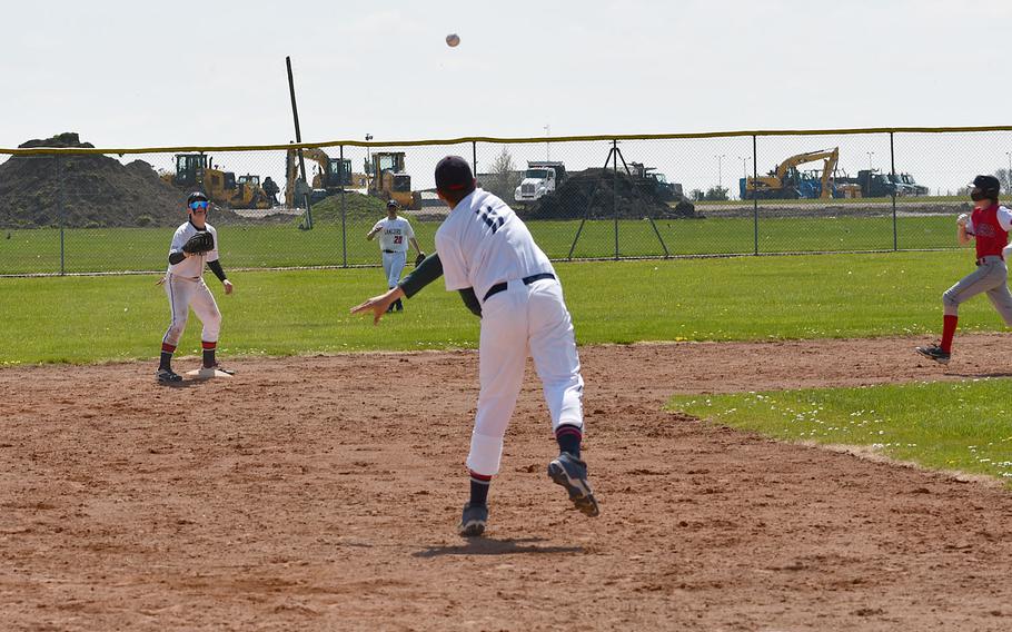 Lakenheath Lancers' Allen Brimmer fields a ground ball at third and throws to second for the force out against the Kaiserslautern Raiders on Saturday, April 29, 2023, at RAF Feltwell, England.