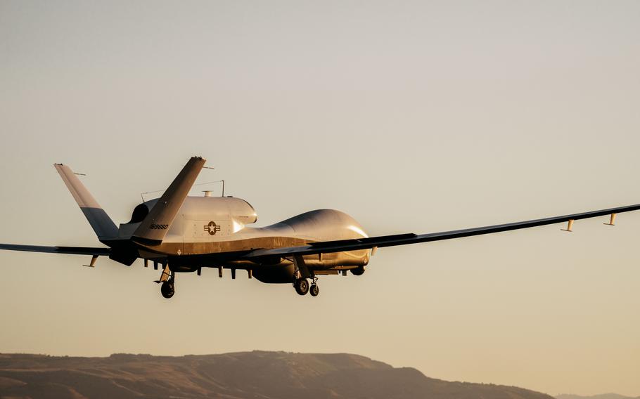An MQ-4C Triton comes in for a landing at Naval Air Station Sigonella, Italy, in July 2024. The Navy recently awarded a $267 million contract to Northrop Grumman for two Tritons, part of the service's plan to acquire 27 of the drones.