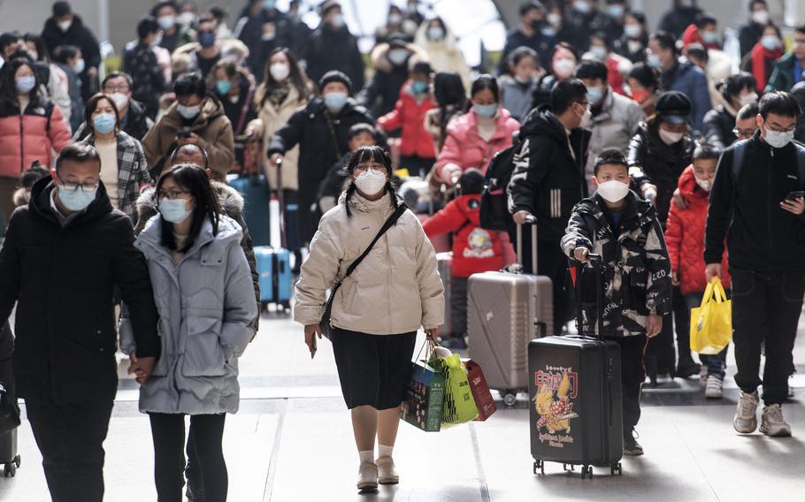 Passengers arrive at Hankou railway station on the last day of the Lunar New Year holidays in Wuhan, in China’s central Hubei province, on Jan. 27, 2023. 