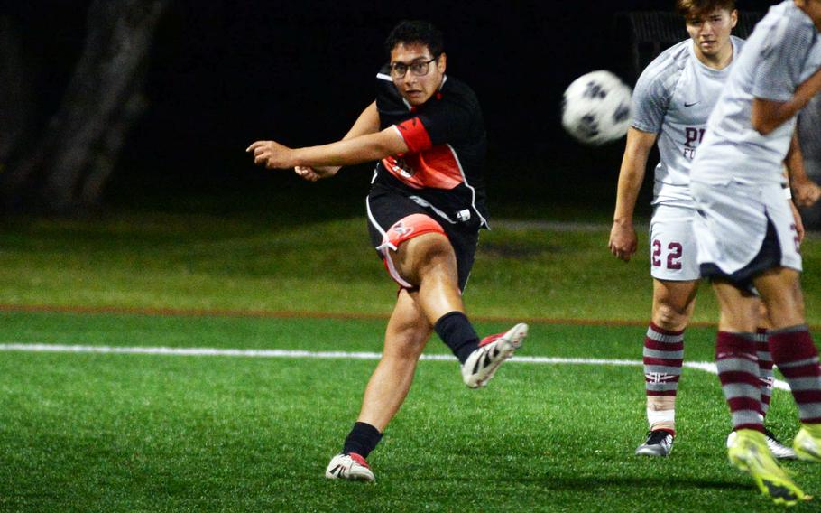 Amin Alipourkashiki kicks the ball.