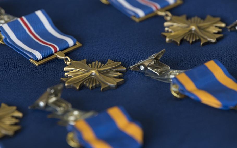 The crew of AC-130 gunship Shadow 71 received Distinguished Flying Crosses and Air Medals for their actions to protect ground forces in Afghanistan in September 2019, at a ceremony at Hurlburt Field, Fla., June 22, 2021.