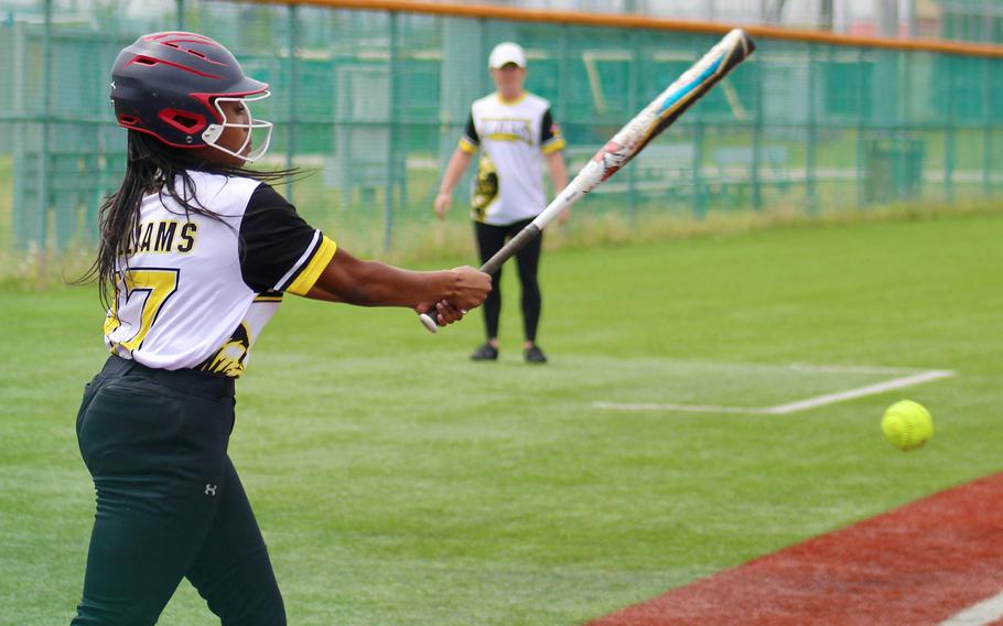 Kadena's Alannah Williams connects during Monday's Far East Division I softball tournament play. The Panthers won both their games to take the lead in the round-robin standings.