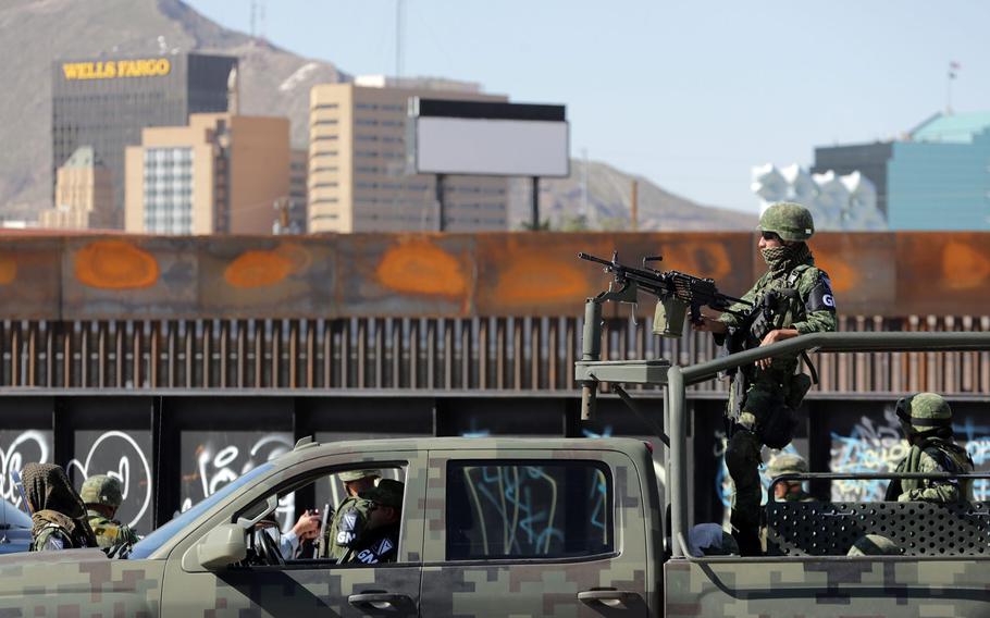 Mexican National Guard soldiers patrol the border between Downtown El Paso and Juarez in 2019.