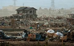 Wreckage waits to be cleared in a tsunami-ravaged area of Sendai, Japan, in March 2011. 