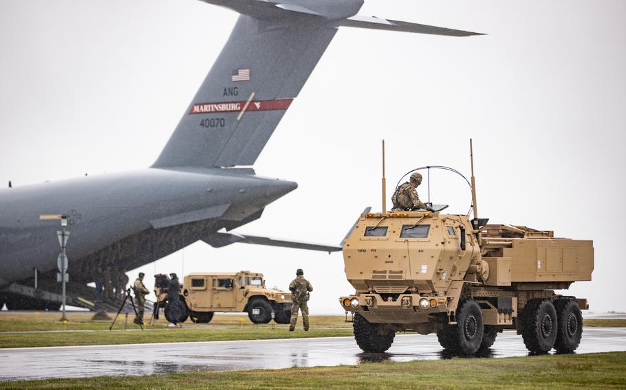 U.S. soldiers assigned to Bravo Battery, 1st Battalion, 14th Field Artillery Regiment, 75th Artillery Brigade and U.S. airmen assigned to the 167th Airlift Wing of the West Virginia Air National Guard unload and employ a High Mobility Multipurpose Wheeled Vehicle and a M142 High Mobility Artillery Rocket System during an exercise in Bornholm, Denmark, on May 24, 2022. 