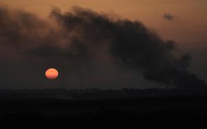 Smoke from an Israeli bombardment rises above a town.