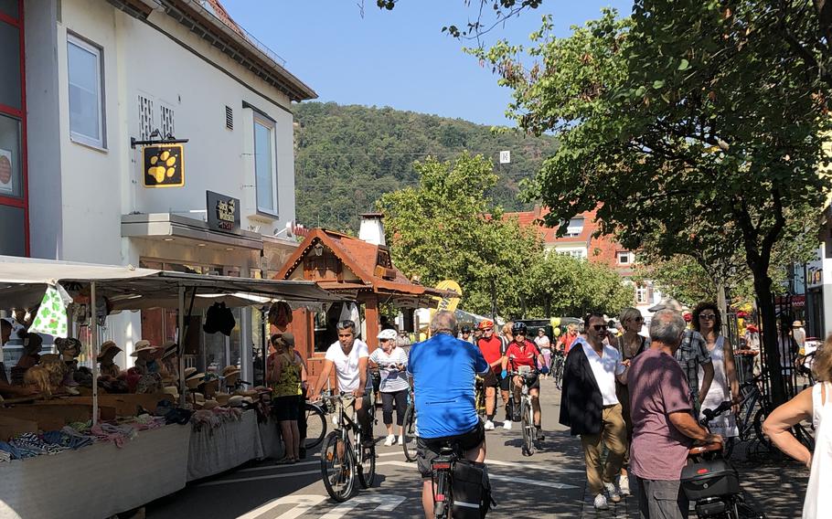 Cyclists and pedestrians crowd the streets of Bad Duerkheim, Germany, on Weinstrasse Experience Day, Aug. 25, 2019. The free bike ride and other events, which usually happen the last weekend of August, have been canceled this year because of the coronavirus pandemic.