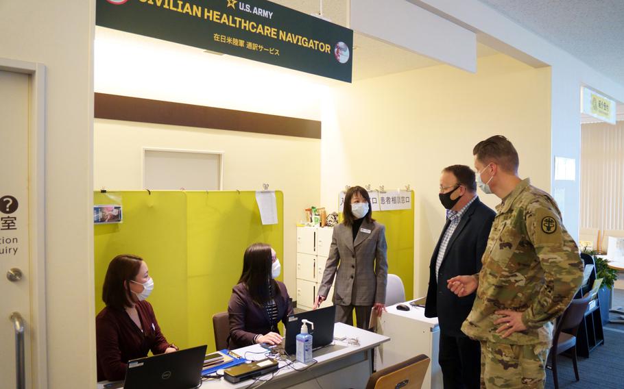 Intepreters staffing a U.S. civilian help desk at Zama General Hospital get a visit from Col. Jeremy Johnson, medical department commander for U.S. Army Japan, Feb. 7, 2024.