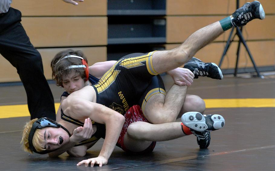 Lakenheath’s Jonah Rothas, rear, beat Stuttgart’s Jackson Coleman in a 126-pound match on opening day of the DODEA-Europe wrestling finals in Wiesbaden, Germany, Feb. 10, 2023.