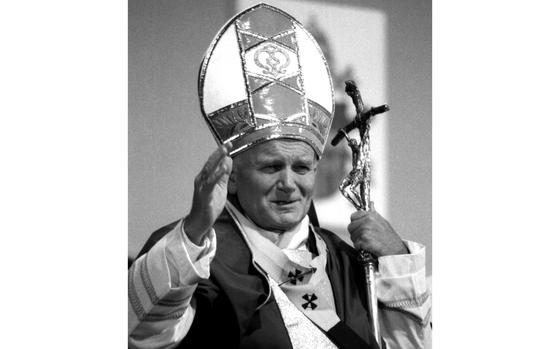 Mainz, West Germany, November, 1980: Pope John Paul II hails the crowd of more than 200,000 people — an estimated 6,000 of them Americans — during a Mass in windy, rainy weather at the U.S. Army's Mainz-Finthen airfield. The pontiff was on a five-day, seven-city visit to West Germany. 

Looking for Stars and Stripes’ historic coverage? Subscribe to Stars and Stripes’ historic newspaper archive! We have digitized our 1948-1999 European and Pacific editions, as well as several of our WWII editions and made them available online through https://starsandstripes.newspaperarchive.com/

META TAGS: Roman Catholic Church; Vatican; Pontiff; Pope; Catholicism; 