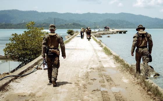 Members of the 15th Marine Expeditionary Unit walk down a pier during the Archipelagic Costal Defense exercise at San Vicente in Palawan, Philippines, May 18, 2024. 