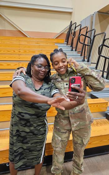 Army Spc. Kennedy Sanders, right, posing for a selfie with her mother, Oneida Oliver-Sanders, at a ceremony in Columbus, Ga., on Aug. 9, 2023.