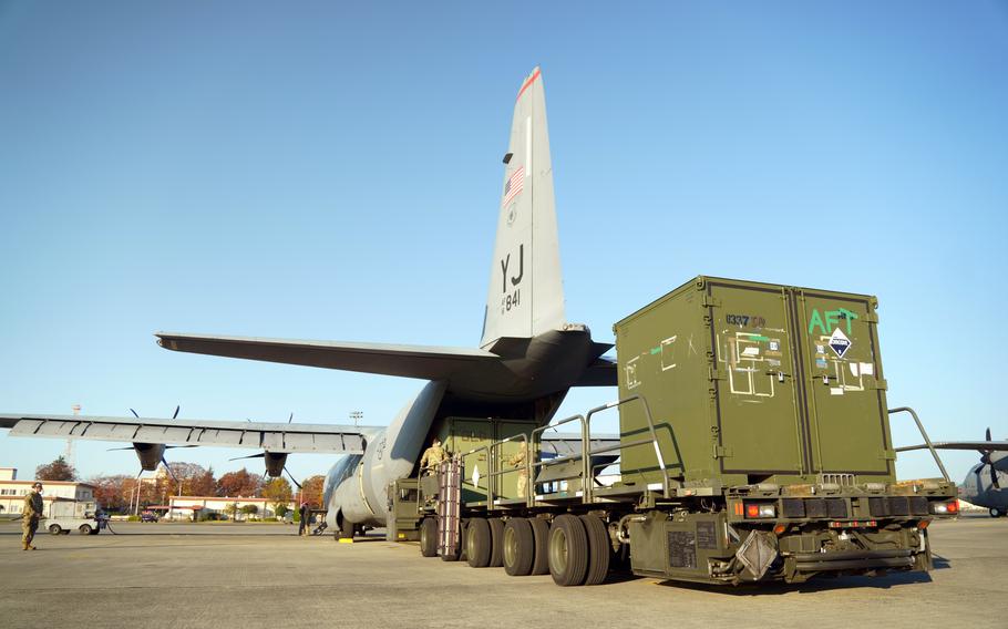 Operation Christmas Drop supplies are loaded onto a C-130J Super Hercules at Yokota Air Base, Japan, Monday, Nov. 27, 2023. 