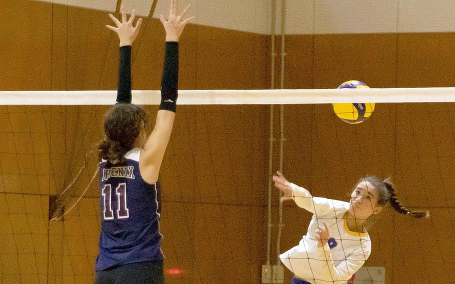 Yokota's Erica Haas spikes against Seisen International's Pippi Hill during the Phoenix' three-set victory over the Panthers during Friday's American School In Japan YUJO Tournament pool-play match.