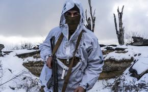 Anatoliy, a Ukrainian soldier with the 56th Brigade, in a trench on the front line on Jan. 18, 2022 in Pisky, Ukraine. Negotiations this week between Russia and the U.S. over the prospect of a Russian invasion of Ukraine ended inconclusively. (Brendan Hoffman/Getty Images/TNS)