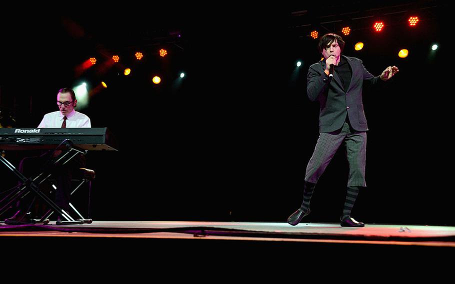 Musicians Ron Mael (left) and Russell Mael of Sparks perform onstage during day 1 of the 2013 Coachella Valley Music & Arts Festival at the Empire Polo Club on April 12, 2013 in Indio, California. 