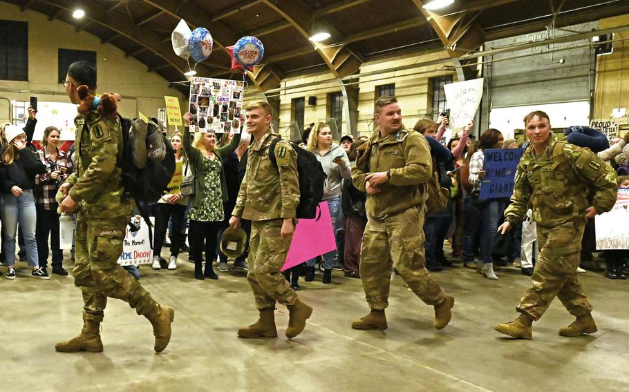 New Hampshire Guardsmen reunite with friends and family at a a welcome home ceremony for the 3rd Battalion, 197th Field Artillery Regiment on Feb. 8, 2024, at the Manchester, N.H., armory.